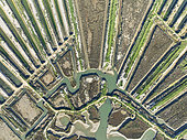 Saline ponds at the salt works of Isla Cristina. Aerial view. Drone shot. Huelva province, Andalusia, Spain.