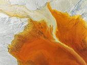 Waste pond in the mineral-rich area of the Rio Tinto mines. The colour is caused by oxidised iron minerals. Aerial view. Drone shot. Huelva province, Andalusia, Spain.