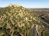 The impressive eighth-century Moorish castle of Almodóvar del Río perches high above the Guadalquivir river valley. Aerial view. Drone shot. Córdoba province, Andalusia, Spain.