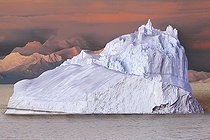 Icebergs and large fragments of drifting ice, here in the light of a summer evening, giant icebergs floating on the southern sea, climate melting global warming. Marguerite Bay, George VI Channel, Expedition below the Antarctic Circle