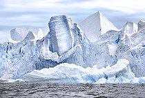 Iceberg and large fragments of drifting ice, here iceberg floating in front of the Antarctic Peninsula, climate melting global warming. Marguerite Bay, George VI Channel. Expedition below the South Polar Circle in Antarctica