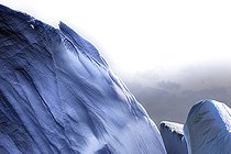 Iceberg and large fragments of drifting ice, here iceberg floating in front of the Antarctic Peninsula, climate melting global warming. Marguerite Bay, George VI Channel. Expedition below the South Polar Circle in Antarctica