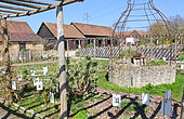 Future garden flowers and the Arche de la Nature well in spring, Le Mans metropole, Sarthe, France