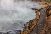 Oyunuma sulfur lake, Jigokudani, Noboribetsu , Hokkaido island, Japan. The road runs alongside Lake Oyunuma, formed by the eruption of a volcano. It's an acidic lake with high temperatures (45° at the surface and up to 130° at depth).