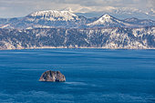 Lake Mashû caldera, with the central island, "Kamuishima", Island of the Gods. The Lake Mashû caldera is 6 kilometers long. Located at the foot of Mount Kamui in Akan-Mashû National Park, it was formed 4,000 years ago by the collapse of the Mashû volcano after its eruption. The lake is famous in Japan for the transparency of its waters.