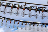 Night fishing lamps, Hakodate harbor, Hokkaido Island, Japan. At night, fish and squid are attracted by the light of the lamps and gather near the boat. They are then caught with nets. This is an ancient fishing technique.