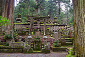 Funerary monument in the Okunoin necropolis, Japan's largest cemetery, Mount Koya, Osaka, Japan. At the foot of Mount Koya, a sacred Buddhist pilgrimage site, lies Japan's largest and most prestigious cemetery.