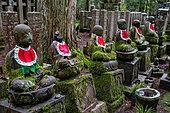 Set of Jizô, statuettes from Okunoi cemetery, Mount Koya, Osaka, Japan. These statuettes are the protectors of deceased children, dressed in bibs by local inhabitants, who also place offerings at their feet.