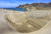 Wind-swept dune at Cabo de Gata in Andalusia. Huge crescent-shaped dune at Playa de Monsul - Cabo de Gata Geopark