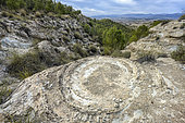 Seismites in the Granada Geopark, Spain. Galera and Castilléjar seismites: seismic waves transform sediments into a kind of quicksand. The water in the sediment's pores is expelled, separating the grains and transforming the material into a viscous fluid (liquefaction) that congeals into thousands of concentric structures throughout the sedimentary stratum.