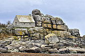 Customs house surrounded by rocks, Kerfissien beach, Cléder, Finistère, Brittany, France