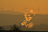 Industrial smoke and wind turbines; Lomont massif, Pays de Montbéliard, Doubs, France