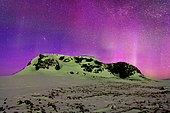 Purple auroras over Cape Swainson, Scoresby Strait, ScoresbySund, Greenland