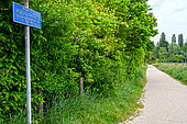 Sign "Promenade Robert Hainard", the great naturalist of our time, engraver, sculptor and philisopher, Yverdon-les-bains, Switzerland. This promenade is one of Switzerland's top ornithological sites on the shores of Lake Neuchâtel.