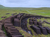 Traditional peat cutting, peat is still used as fuel for fireplaces, on the island Foula, part of Shetland Islands. Europe, Great Britain, Scotland, Northern Isles,summer