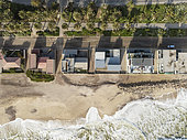 Upmarket seaside villas at the coastal town of Swakopmund between Namib Desert and Atlantic Ocean. Aerial view. Namibia.