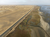 The Walvis Bay Lagoon between Namib Desert and Atlantic Ocean at low tide. Aerial view. Drone shot. Namibia.