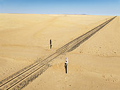 Rails and level crossing in the southern Namib Desert. Aerial view. Drone shot. Namibia.