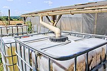 Rainwater harvesting tanks in a private garden, Vouvray sur l'Huisne, Sarthe, France