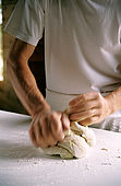 hands kneading the dough