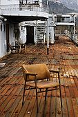 On old chair sits onthe rusting deck ot Galeb, Tito's old luxury yacht, Rijeka, Croatia