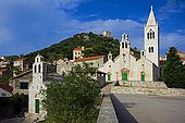 Croatia Lastovo Island Lastovo village - The main square with the Sv Kuzma i Damjan church at right and Sv Marija church at left and the Kastel in background, over the hill..