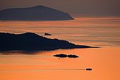 Croatia - Lastovo island - Fishing-boat at sunset on Prezba archipelago.