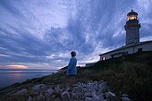 Croatia - Lastovo island - Skrivena bay - Struga lighthouse - Nada Kvinta, lighthouse-keeper wife, looking at the panorama at dusk.