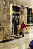 Reflection in the window of Antico Bar, Bassano del Grappa, Veneto, Italy. tel: 0424 521161