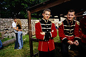 Trakai, Lithuania: young members of a band at a band festival at ruins of the peninsular castle.