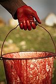 Hand and bucket of a dyer, the tanneries, Fes, Morocco