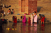 Bathing in the Ganges river at dawn.