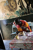 Masai at lunch in the Assam butchery, a meeting place near the Talek Gate of the Masai Mara National Reserve