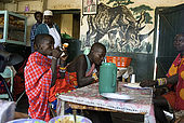 Masai having lunch at the Assam butchery, meeting place near the Talek Gate of the Masai Mara 