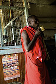 Masai man in the Assam butchery, meeting place near the Talek Gate of the Masai Mara 