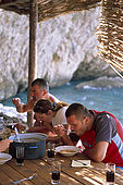 Balkan, Adriatic sea coast    Republic of Montenegro    near Budva Pic nic     on the beach 'Kajanegra'    eating fisherman soup    Model Release OK        