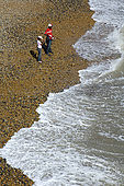 Children on the stone beach at Brighton
