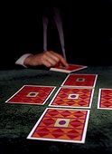 A man dealing tarot cards
