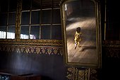 Reflection In A Mirror Of A Young Girl Running Through The House; Tanjung Lubuk Sumatera Selatan Indonesia